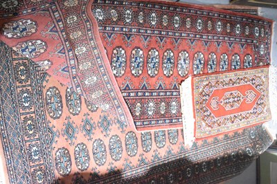 Lot 605 - A Middle Eastern peach ground rug, a runner of...