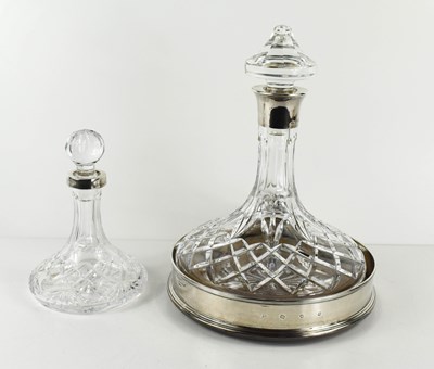 Lot 261 - A silver collared cut glass ship's decanter,...