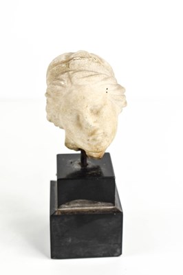 Lot 224 - An ancient marble carved female head, of...