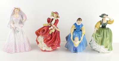 Lot 162 - A group of four Royal Doulton ladies,...