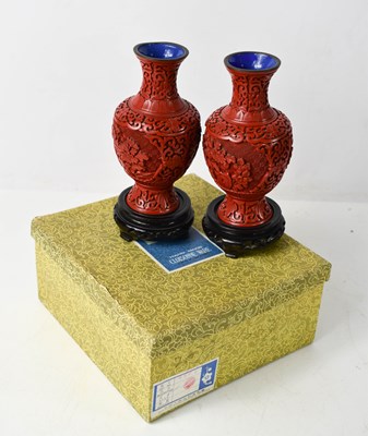 Lot 115 - A pair of 20th century Chinese Cinnabar vases,...