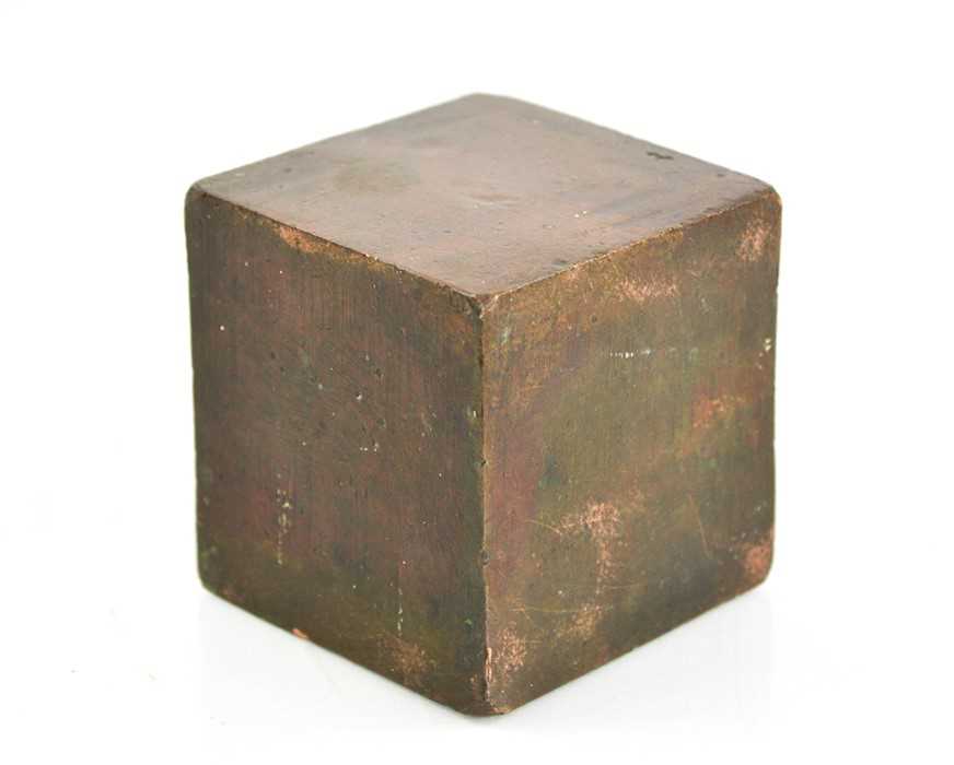 Lot 129 - A solid antique bronze cube, 8cm square.