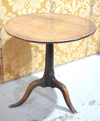 Lot 623 - An 18th century oak side table with circular...