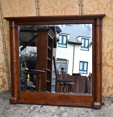 Lot 582 - A large modern pine overmantel wall mirror...