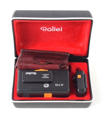 Lot 132 - A vintage Rollei camera, flash and pouch in...