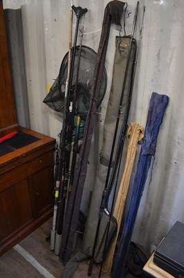 Lot 590 - A group of fishing rods, rod holdalls, nets,...