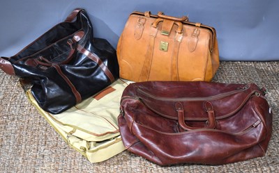 Lot 239 - Two Italian leather holdalls together with...