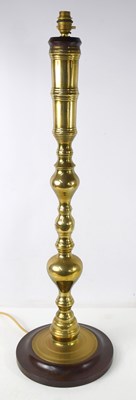 Lot 155 - An impressive brass table lamp of baluster...