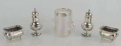 Lot 284 - A group of silver to include salt and pepper...