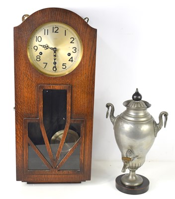 Lot 176 - An Art Deco oak cased wall clock, the Eldred...