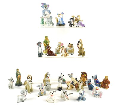 Lot 155 - A collection of Wade Whimsies and figurines to...