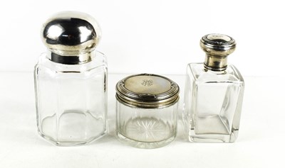 Lot 25 - Three antique glass and silver topped dressing...