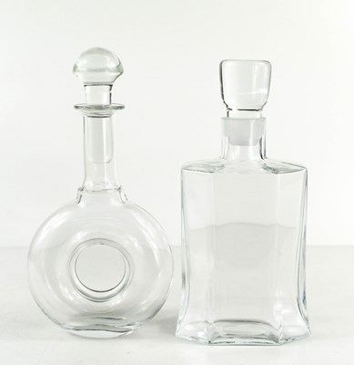 Lot 35 - Two Kosta Boda clear glass decanters, both...