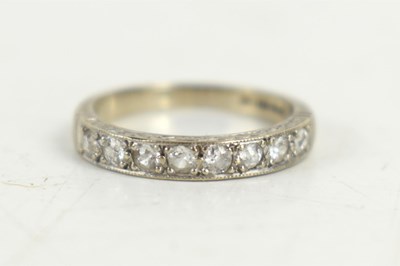 Lot 142 - An 18ct white gold half eternity ring, size K,...