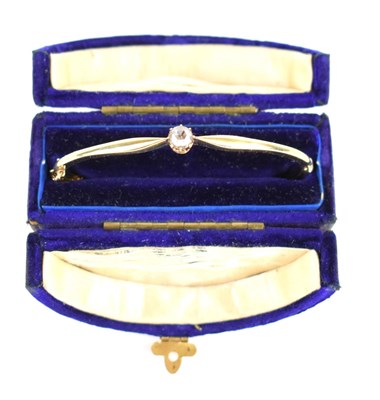 Lot 151 - An Edwardian gold and rose cut diamond bangle,...