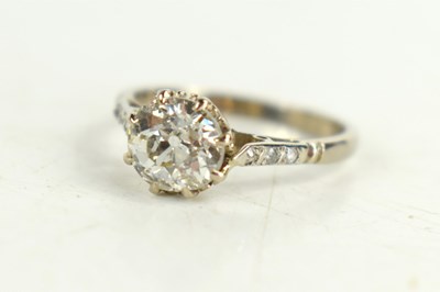 Lot 154 - An 18ct white gold solitaire ring, with old...