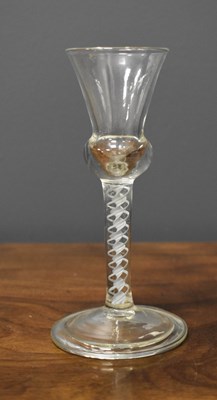 Lot 84 - An 18th century wine glass with thistle shaped...