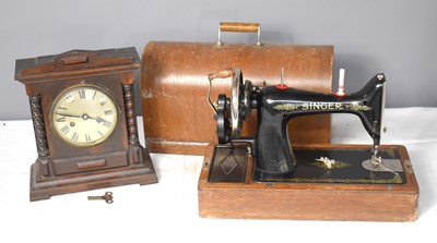 Lot 172 - A vintage Singer sewing machine together with...