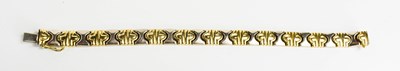 Lot 48 - A bi-colour 9ct gold bracelet of abstracted 'x'...