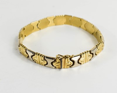 Lot 48 - A bi-colour 9ct gold bracelet of abstracted 'x'...