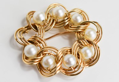Lot 75 - A gold and pearl brooch, in a wreath style,...