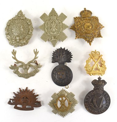 Lot 67 - A group of Victorian and later cap badges to...