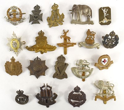 Lot 49 - A group of military cap badges to include...