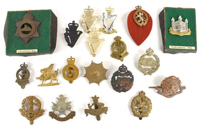 Lot 50 - A group of military cap badges to include...