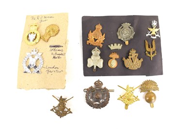 Lot 64 - A collection of military cap badges to include...