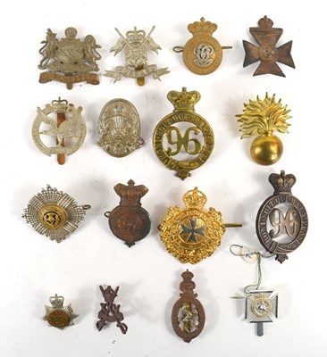 Lot 51 - A collection of military cap badges to include...