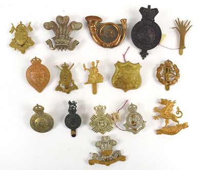 Lot 52 - A collection of military badges to include...