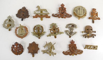 Lot 66 - A group of military cap badges to include 17th...