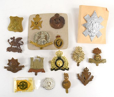 Lot 46 - A group of military cap badges to include the...