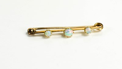 Lot 8 - A Victorian 15ct gold and opal three stone bar...