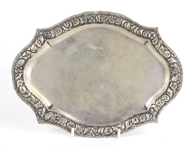 Lot 379 - An antique white metal salver, the border...