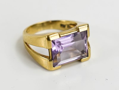 Lot 53 - A 9ct gold and amethyst set dress ring, the...