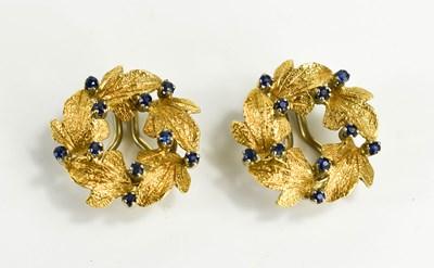 Lot 55 - A pair of 18ct gold and sapphire clip on...