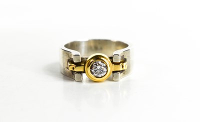 Lot 26 - An 18ct bi-coloured gold and diamond ring by...