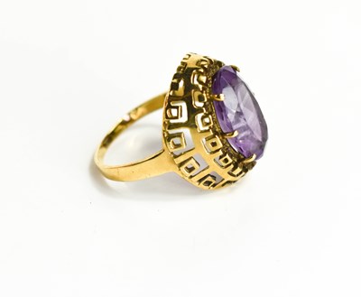 Lot 33 - A large oval set amethyst ring, in raised...