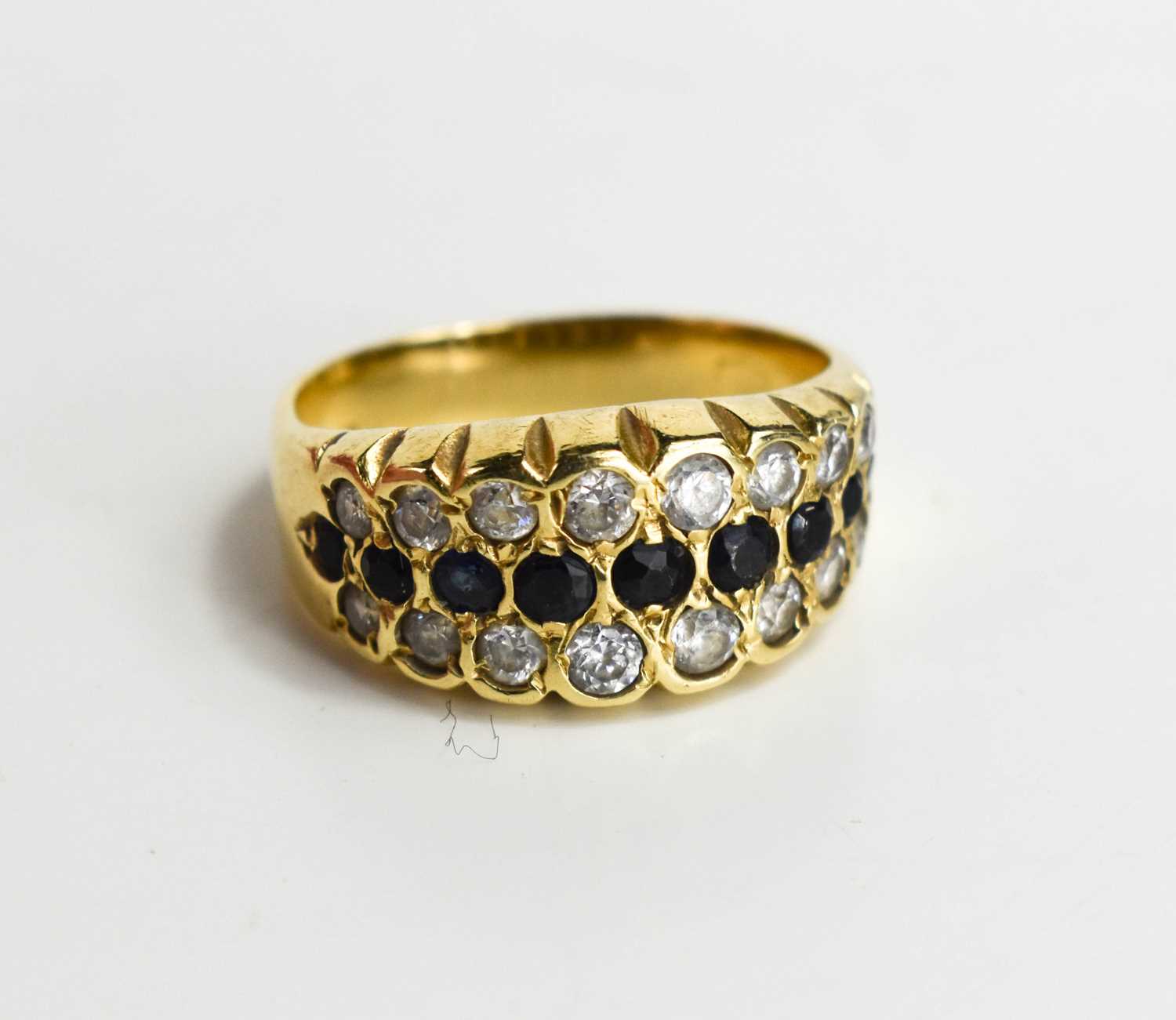 Lot 34 - A 9ct gold sapphire and white stone set ring,...
