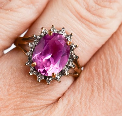 Lot 170 - A 9ct gold, pink sapphire and diamond ring,...