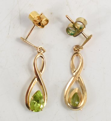 Lot 46 - A pair of 9ct gold and peridot drop earrings.