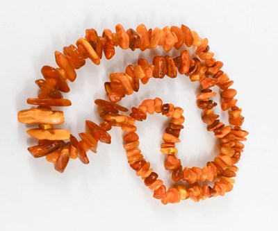 Lot 97 - An amber necklace, composed of rough cut...