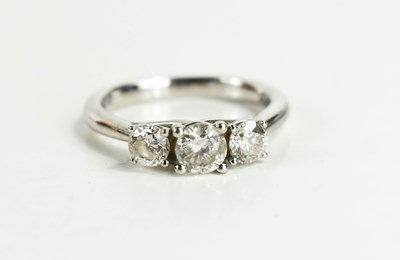 Lot 23 - A 950 platinum & diamond three stone ring, the...