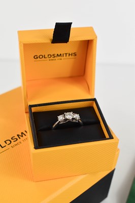 Lot 23 - A 950 platinum & diamond three stone ring, the...