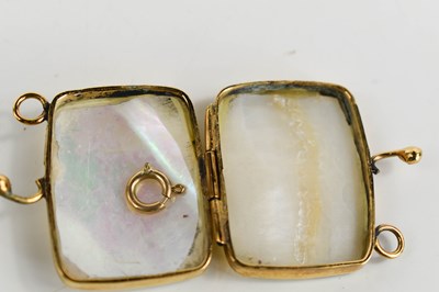 Lot 25 - A gold and mother of pearl miniature purse /...