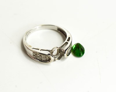 Lot 114 - A white 9ct gold, tsavorite and diamond ring,...