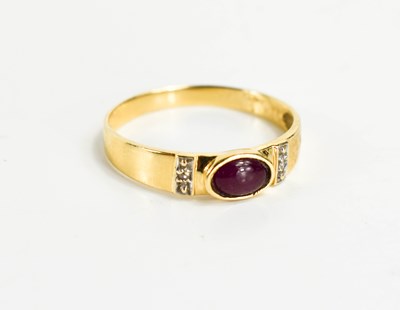 Lot 115 - A 14ct gold, cabochon ruby and diamond set...