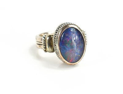 Lot 130 - An Indian silver and black opal ring, the opal...