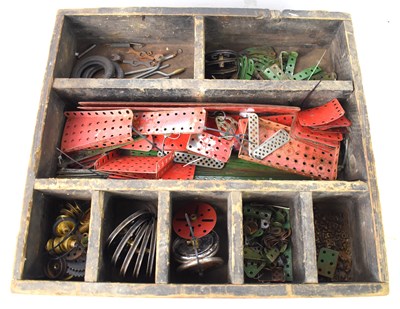 Lot 438 - A collection of vintage Meccano in a wooden box.